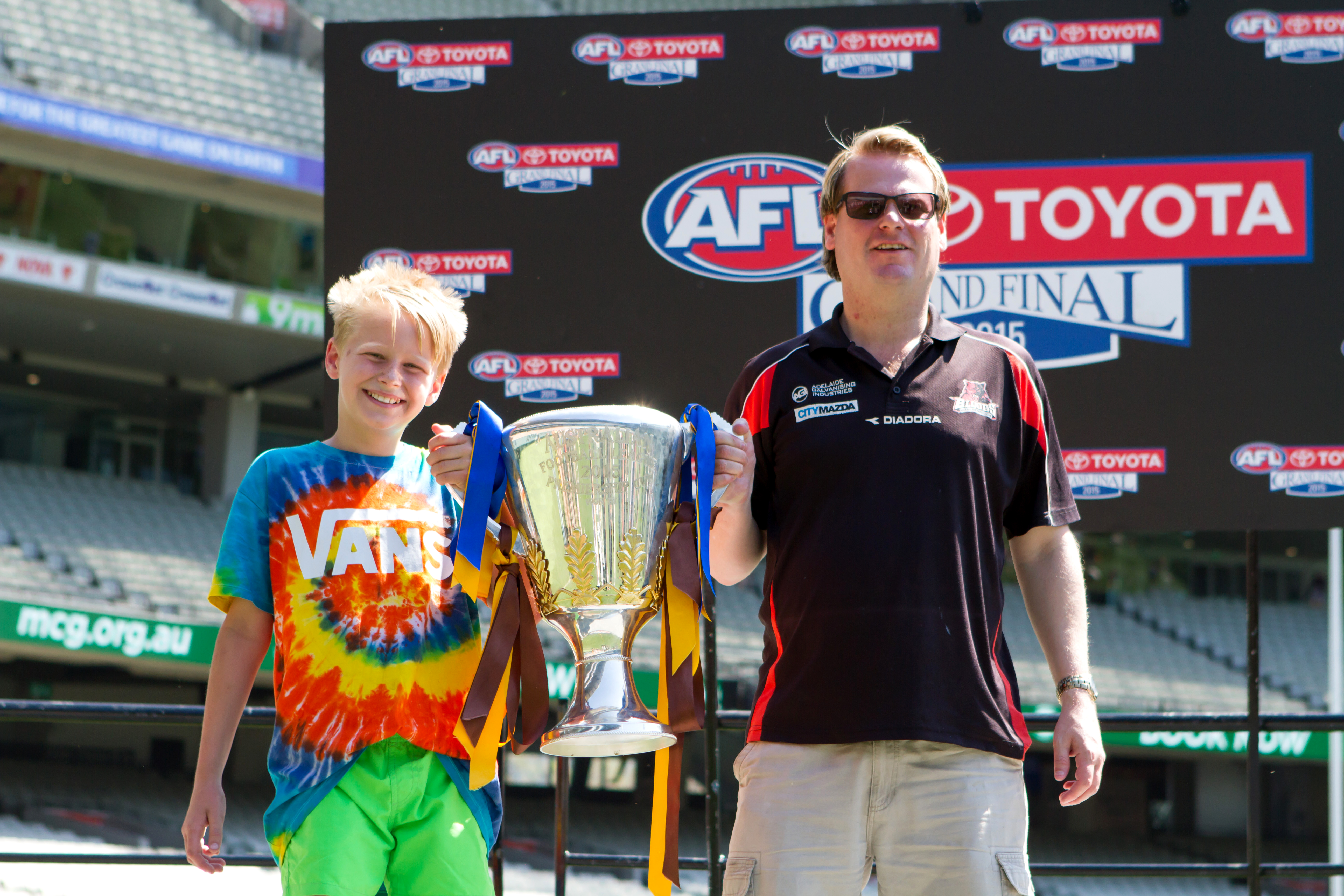 Fans could get a photo with a replica AFL premiership cup at MCG Open Day