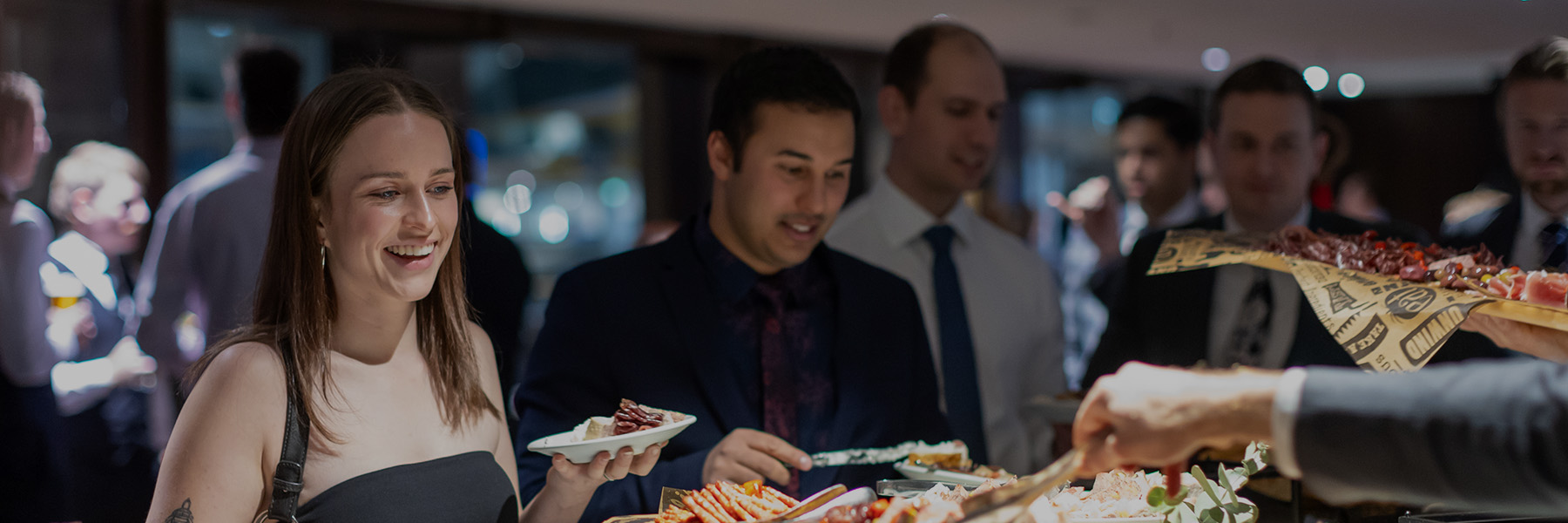 Young Members select food from a grazing food station