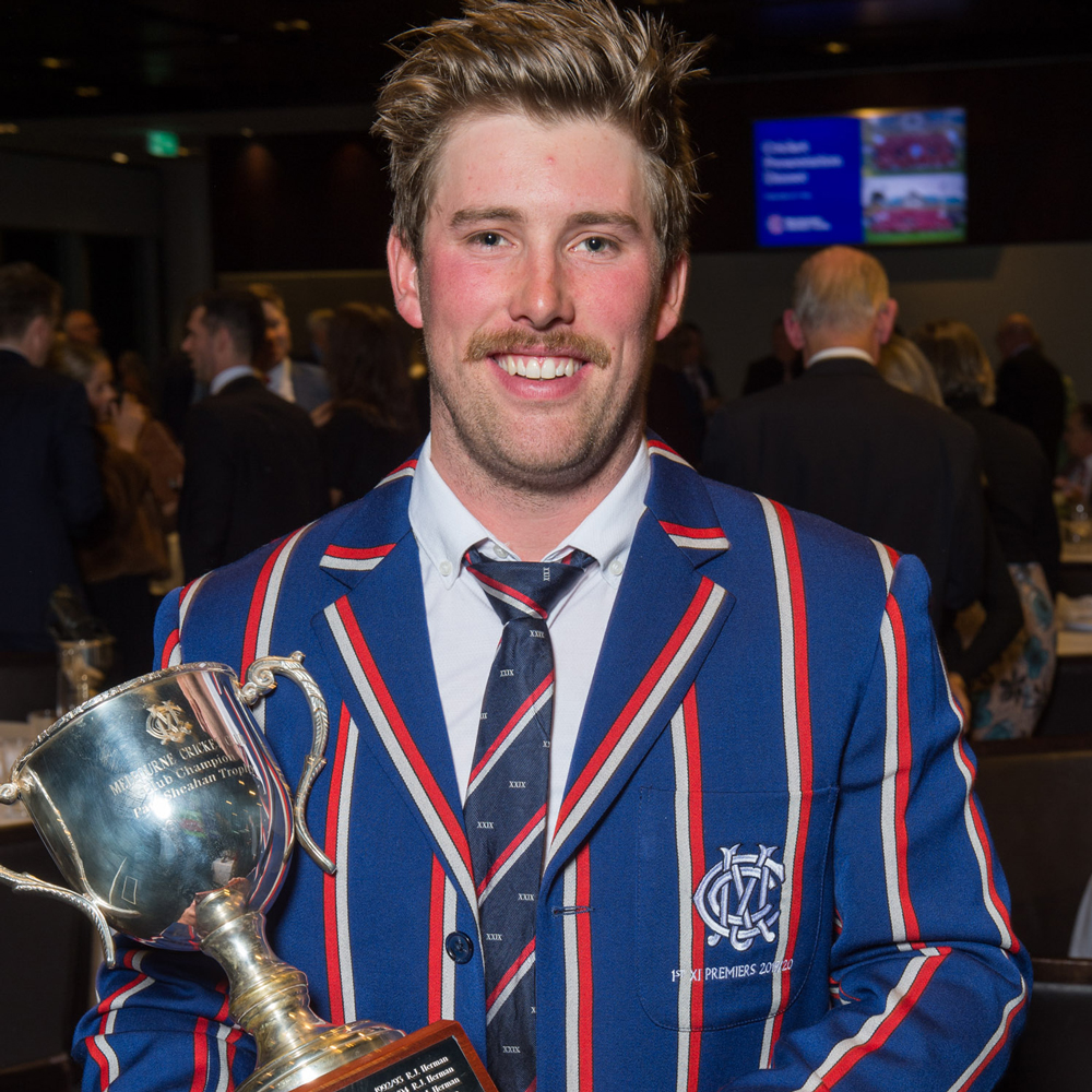 A man holds a trophy that he has won