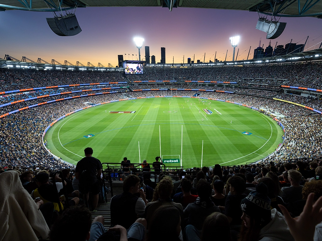 Sunset over the MCG during an AFL match AFL25RD1_RICHvCARL_130_MCC CTA desktop_1024x768.webp