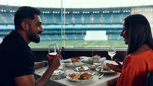 Two people dining on Level 2 of the MCC in the Committee Room Restaurant
