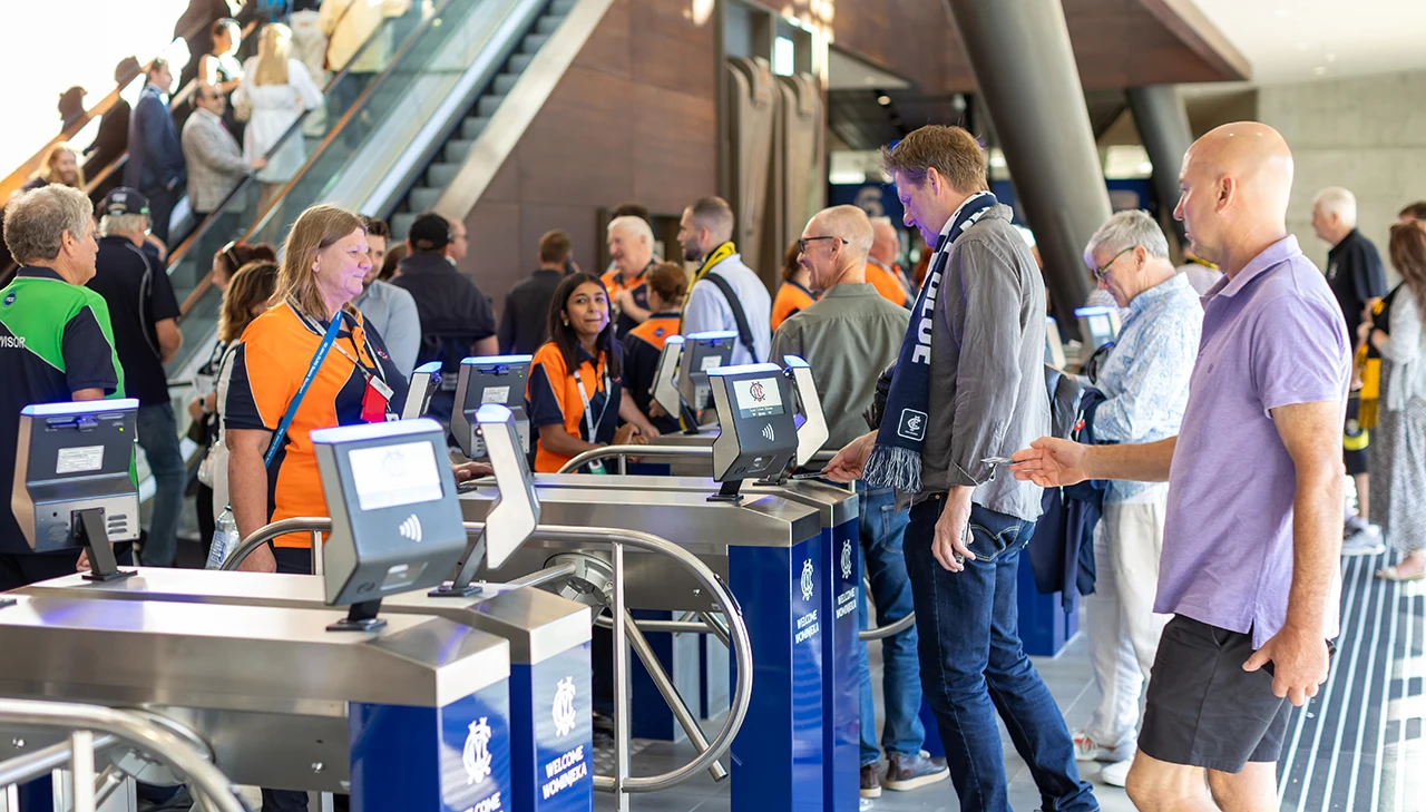 Staff supervise entry turnstiles at MCG Gate 2