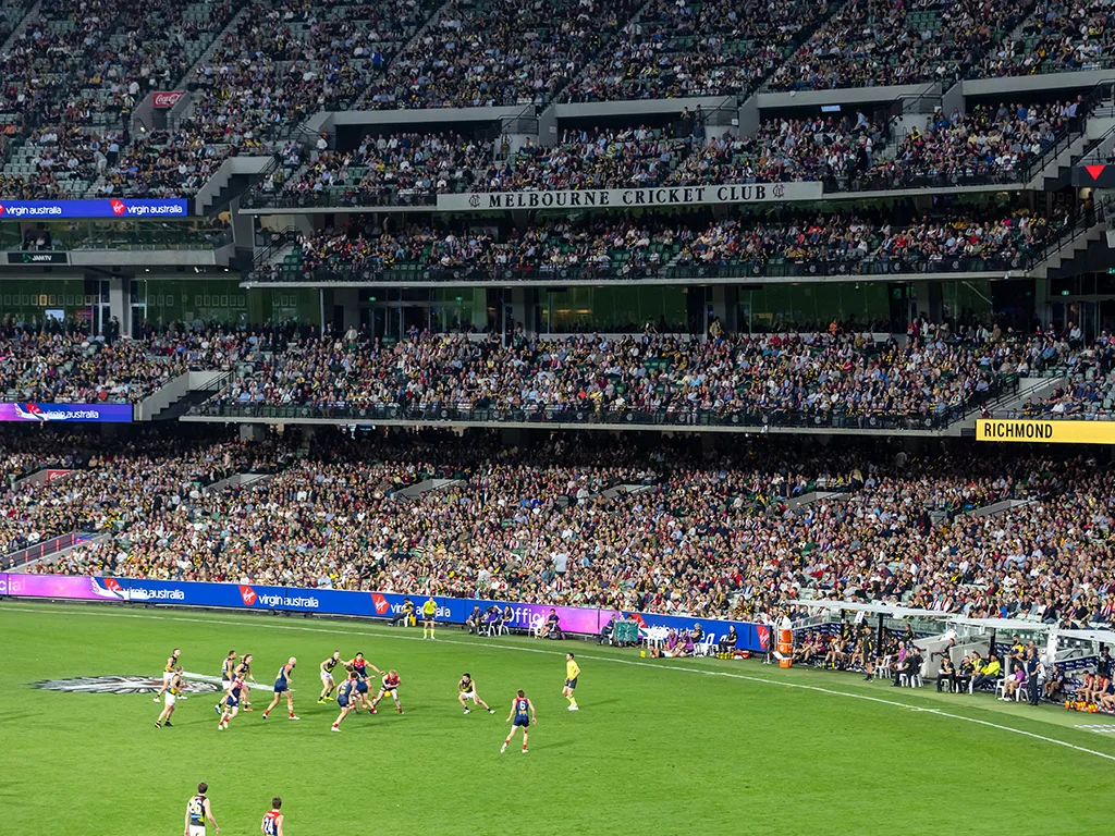 Melbourne and Richmond AFL match against backdrop of Members' Reserve seating stand