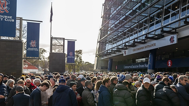 MCC members queue outside Gate 2 of the MCG MCC members queue outside Gate 2 of the MCG