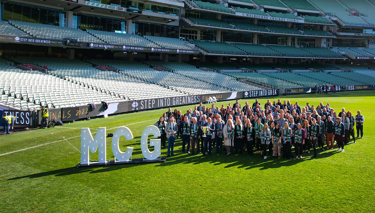 MCC staff stand in the group on the MCG arena MCC staff stand in the group on the MCG arena