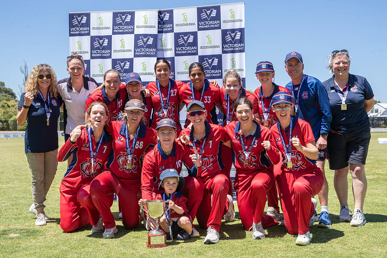 MCC Cricket Women's team photo with premiership cup and medals
