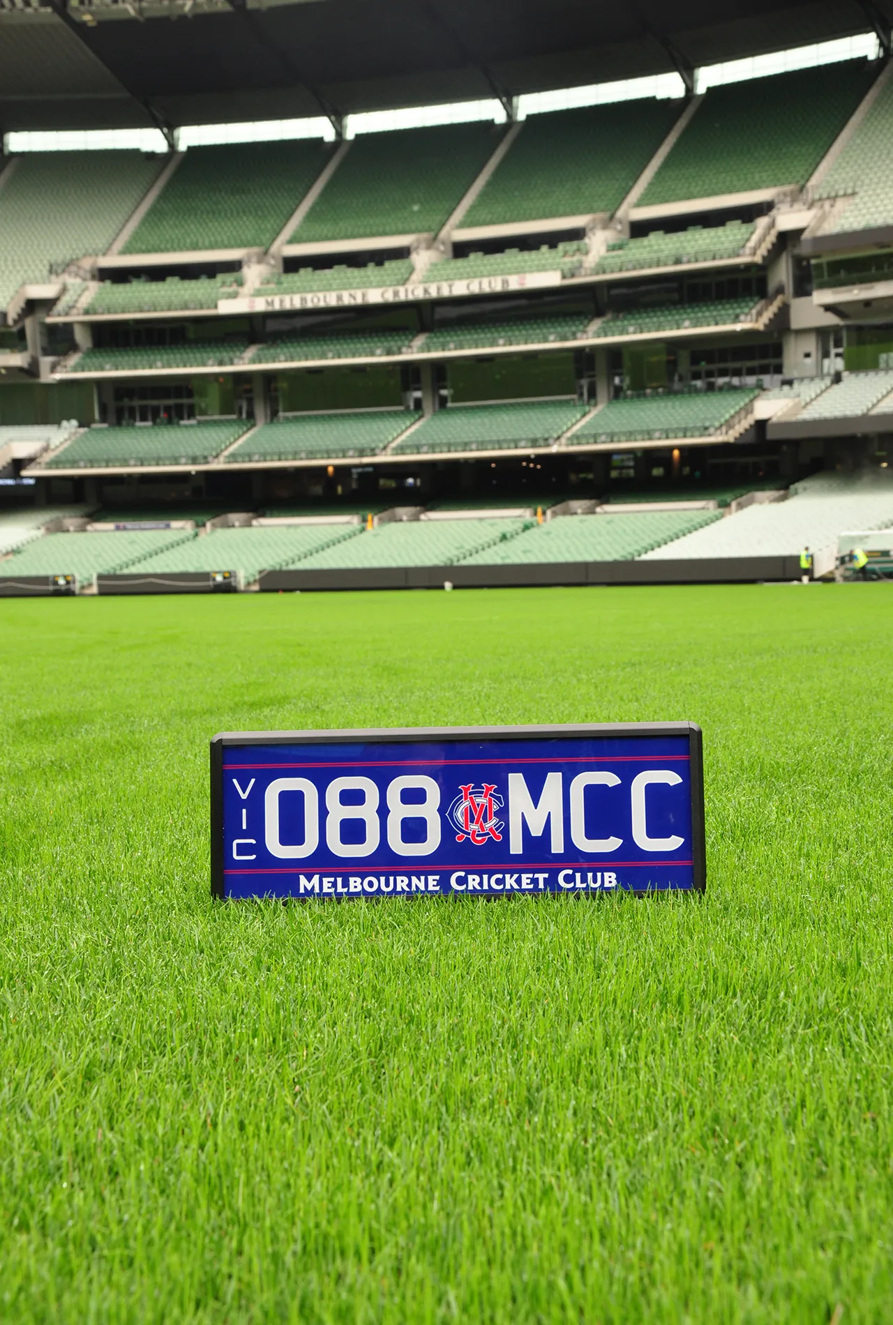Custom 088.MCC number plate placed on the MCG turf in front of Members' Reserve seating