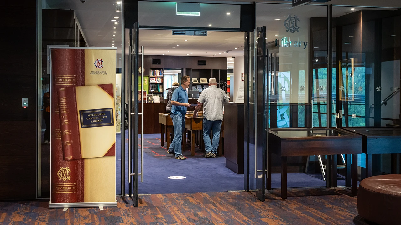 Patrons browse books in the MCC Library